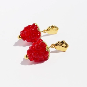 Sweet red glass raspberry berry drop earrings with gold metal accents on white background