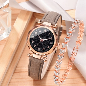 Rose gold watch and diamond bracelet set displayed on elegant background with starry dial