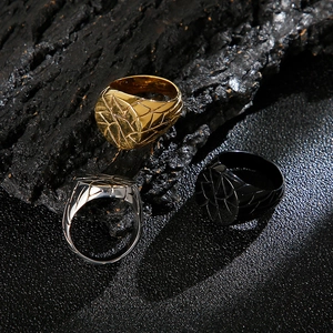 Men's stainless steel signet rings with irregular crack texture in gold, silver, and black