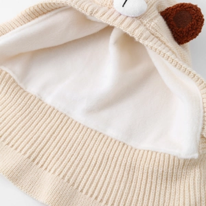 Detailed macro view of soft white fleece lining and thick knitted wool for extra warmth