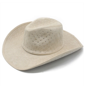 Detailed close-up of beige suede western cowboy hat with all-over rhinestone embellishments