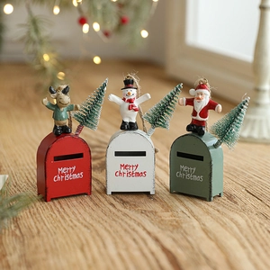 Three festive Christmas mailbox ornaments featuring Santa, Snowman, and Reindeer figurines