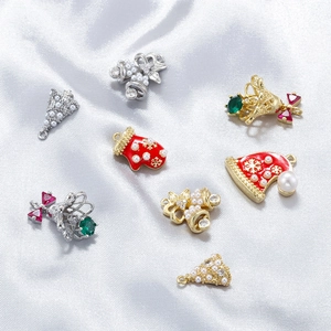 Detailed set of 8 festive Christmas pendants featuring bells and trees on silver silk fabric