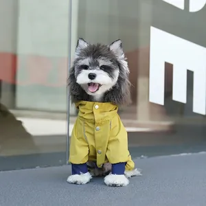 Waterproof dog raincoat with reflective strips and snap buttons in yellow and navy blue