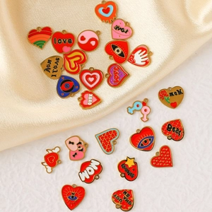 Flat lay of diverse enamel heart charms in 304 stainless steel with colorful patterns