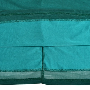Close-up of green dress featuring mesh stitching and detailed seam on smooth fabric