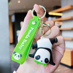 Close-up of silicone panda keychain with green strap and Panda Baby printed text