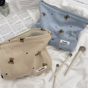 Detail of cute bear corduroy makeup bags with Sozakka tag and smooth zipper closure