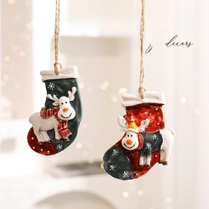 Festive Christmas stocking ornaments with 3D reindeer figures and rustic hanging ropes