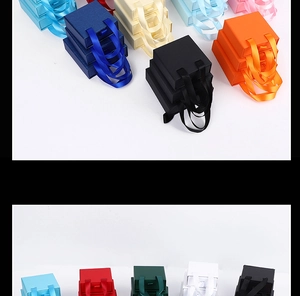 Scatole portagioie colorate a cassetto con manici in nastro in varie dimensioni e colori