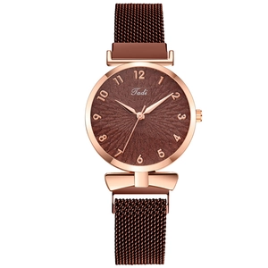 Detailed close-up of brown sunray dial and rose gold Milanese magnetic mesh watch strap
