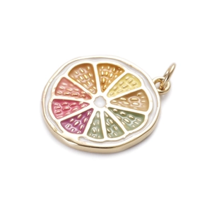 Close-up of colorful enamel fruit slice pendants with jump rings for DIY jewelry making