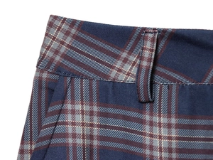 Detailed macro view of the blue plaid cargo pants waistline and belt loop stitching
