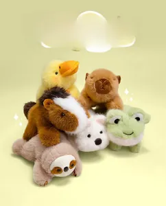 Close-up of cute plush animal fridge magnets including capybara duck and sloth dolls