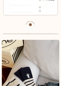 Detail showing navy knit socks with white stripes and cute rabbit embroidery decoration