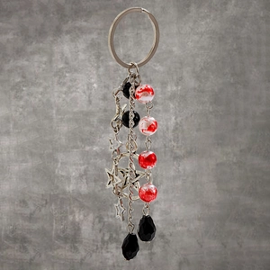 Gothic silver chain keychain with star charms, marble beads, and black drop pendants