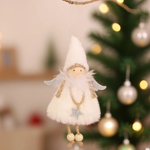 Plush Christmas angel ornament with silver wings and star hanging on a holiday tree branch