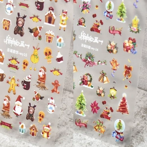 Christmas themed nail art stickers with gingerbread men, santa, and reindeer patterns