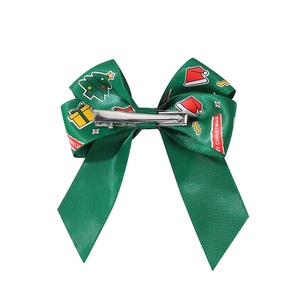 Dark green Christmas ribbon hair bow with festive elk and tree patterns for girls