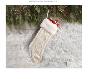 Close-up of knit Christmas stocking with white faux fur cuff and cable stitch details