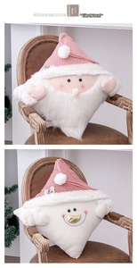 Detail of pink Christmas pillows showing knitted hats and soft plush beard textures