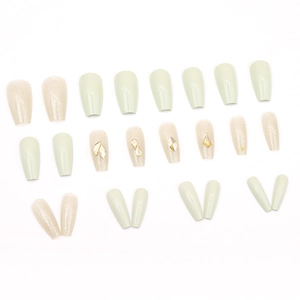 Sparkly white French press-on nails set with rhinestones and ballerina shape tips