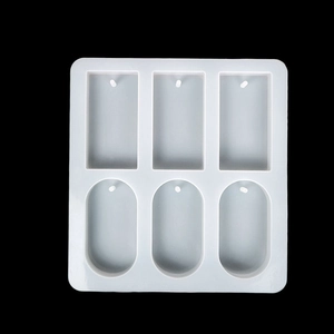 Macro detail of 6-cavity silicone mold with rectangle and oval shapes for DIY craft