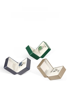 Detail view of premium PU leather watch cases with flip lids and white velvet interior slots
