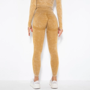 Detail of high-waist acid wash yoga pants showing back scrunch butt lift and peach contouring