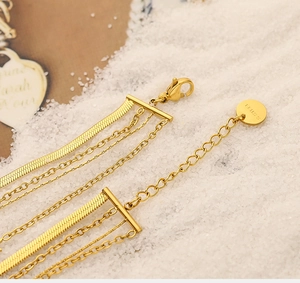 Detailed macro view of 18K gold plated stainless steel snake chain with S.STEEL hallmark