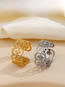 Detailed macro view of vintage openwork rings in gold and silver finish options