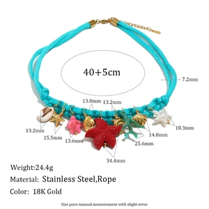 Woven blue rope necklace with 18K gold-plated ocean charms and stainless steel clasp