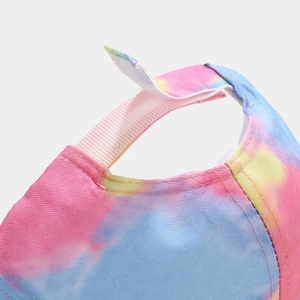 Macro detail of adjustable velcro strap on colorful tie-dye baseball cap with fine stitching