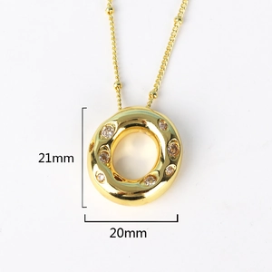 Detailed view of hip hop gold letter pendant with dimensions 21mm by 20mm and tiny diamonds