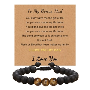 Detail of tiger eye and obsidian bracelet on a card for Dad with sentimental English poem