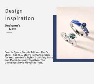 Detailed view of astronaut couple rings with blue enamel starry sky and sparkling zircon stone