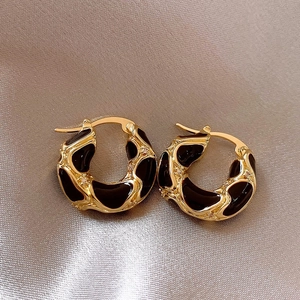 Retro gold C-hoop earrings with black enamel lava drip pattern and zircon stones