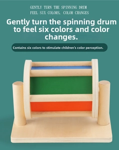 Detail of Montessori rotating textile drum with multi-colored wooden panels for kids