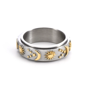 Rotating stainless steel celestial ring with gold sun, moon, and star relief motifs
