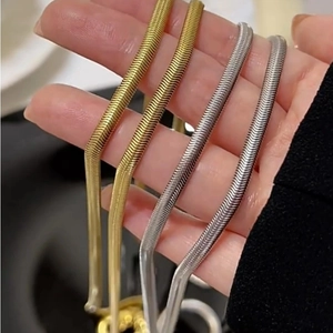 Minimalist long snake bone chain necklace set in premium gold and silver polished finish