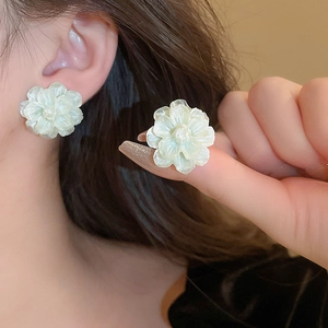 Elegant acrylic flower stud earrings in light green with a pearlescent finish for women