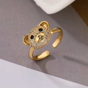 Detailed close-up of a gold-plated bear ring featuring micro-paved white zircons and black eyes