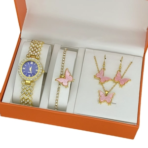 Elegant gold quartz watch set with blue dial and pink butterfly jewelry in a gift box