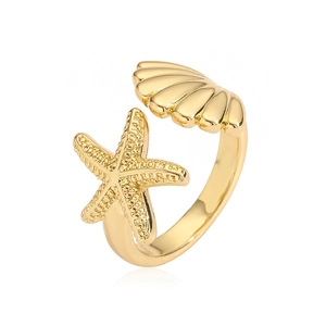 Detailed close-up of adjustable golden ring featuring a starfish and seashell charm