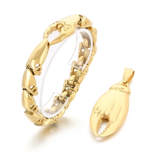 Parure de bijoux en acier doré avec bracelet et pendentif en forme de pince de crabe