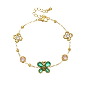 Bracciale in acciaio dorato con farfalla in zircone verde e ciondoli a forma di fiore