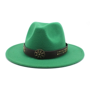 Detail of green felt wide-brim hat with brown leather band and brass flower ornament