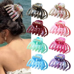 Marbled resin shark hair claw clips in various colors with metal spring for women