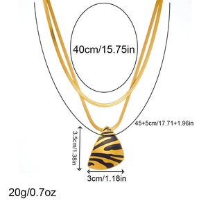 Double-layered gold snake chain necklace with black zebra print triangle pendant details