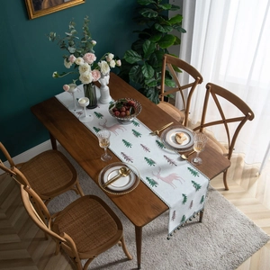 Christmas table runner with pine trees and reindeer jacquard patterns and tassels
